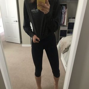 TWO pairs of cropped under armor leggings